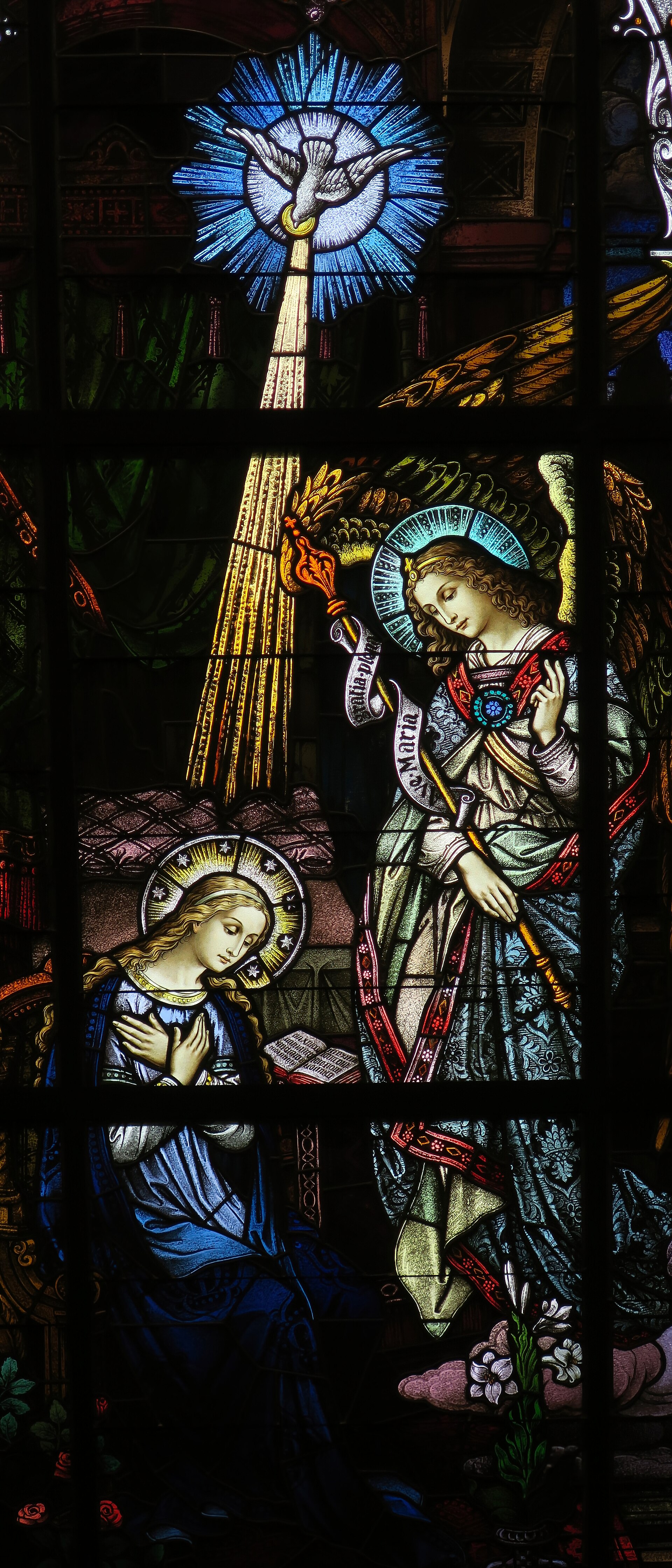 A stained-glass window of the Annunciation: the angel Gabriel appearing to the Virgin Mary