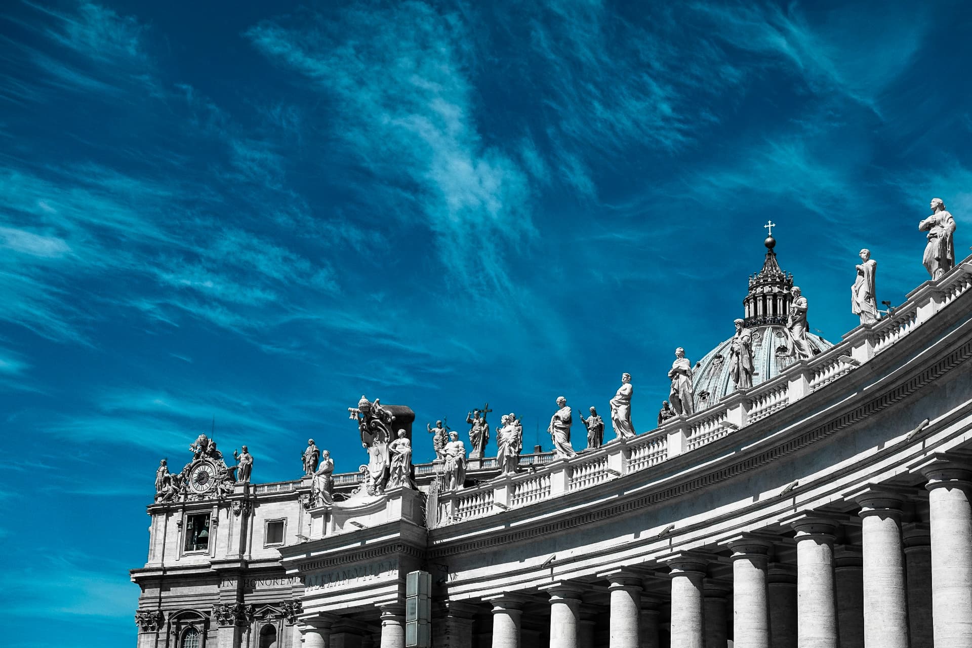 Statues of saints lining the rooftop colonnade of St. Peter's Square at the Vatican